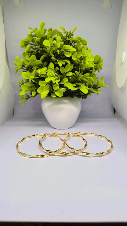 Elegant Gold-Tone Twisted Bangles ✨