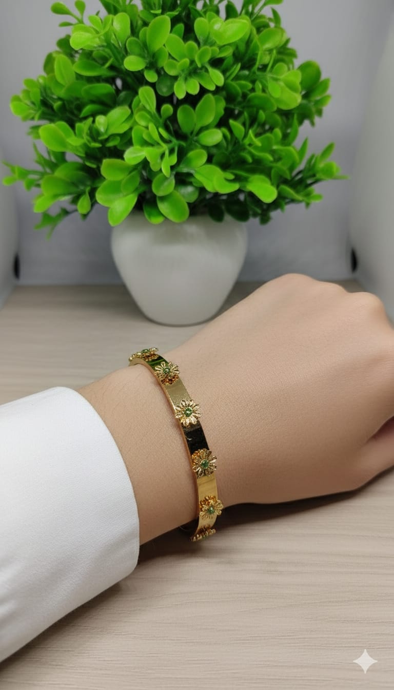 Gold Floral Bloom Bangle with Emerald-Green Accents