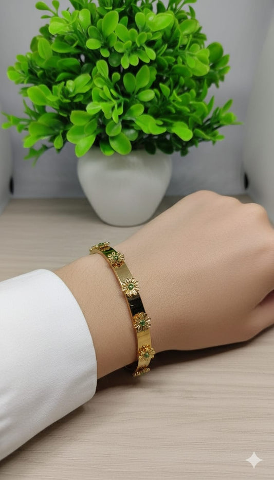Gold Floral Bloom Bangle with Emerald-Green Accents