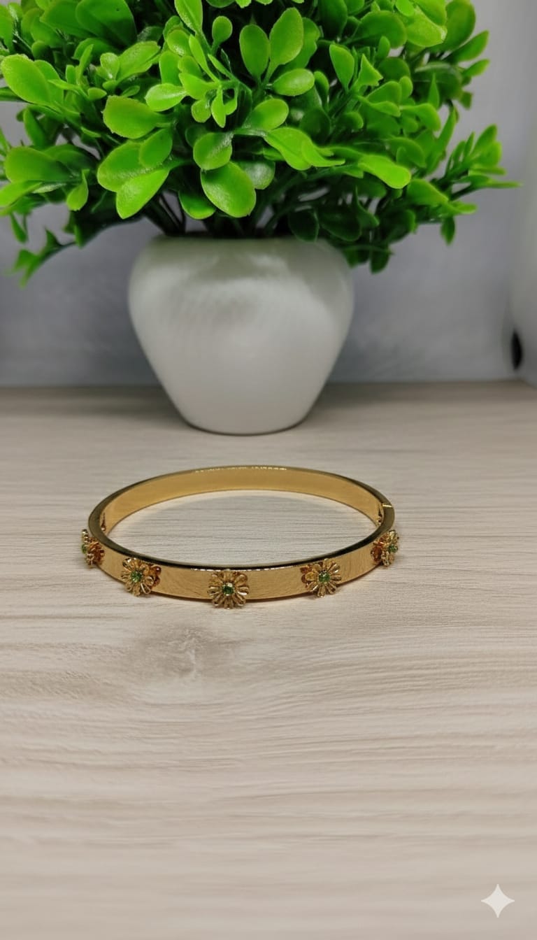Gold Floral Bloom Bangle with Emerald-Green Accents