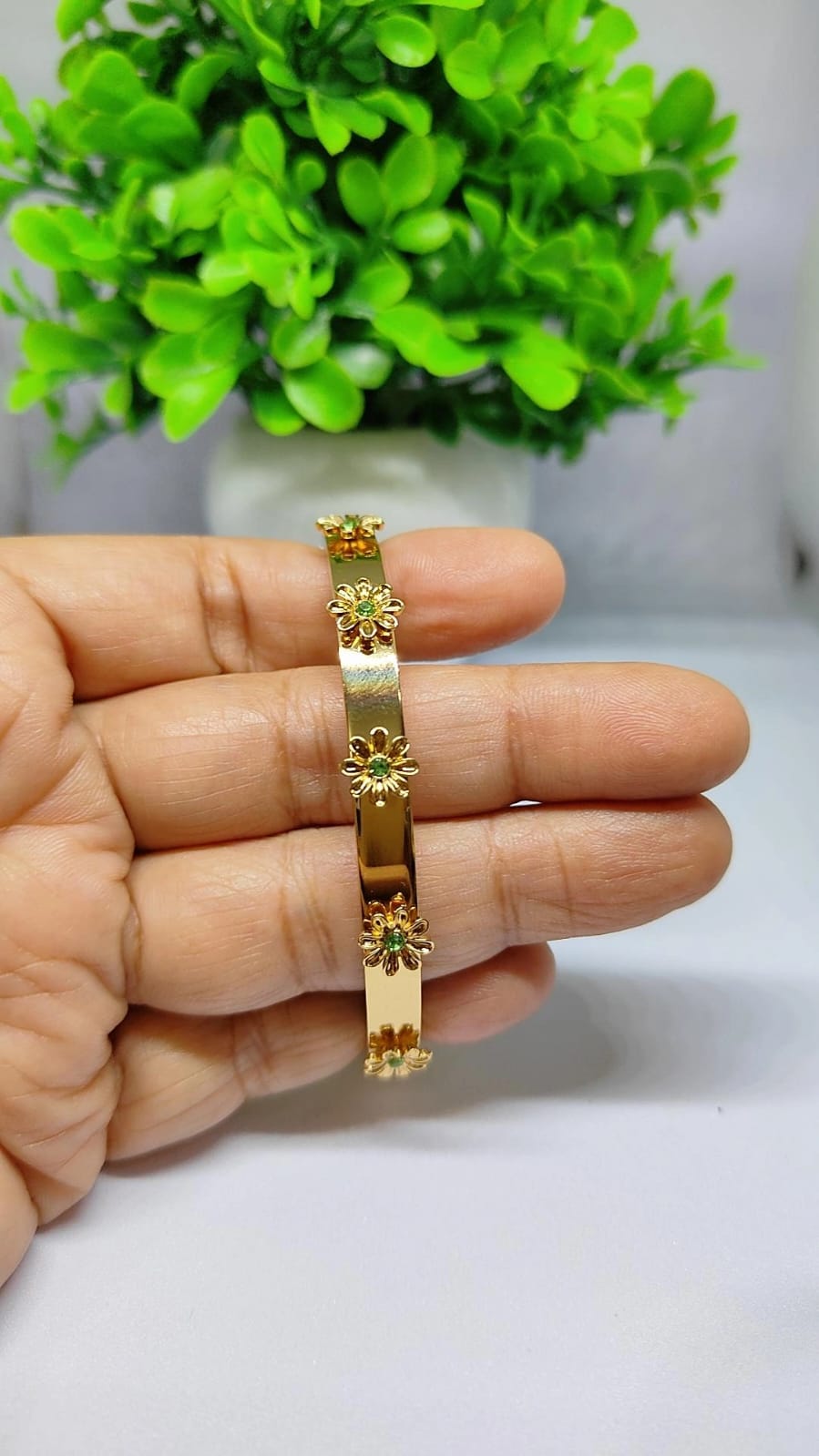 Gold Floral Bloom Bangle with Emerald-Green Accents