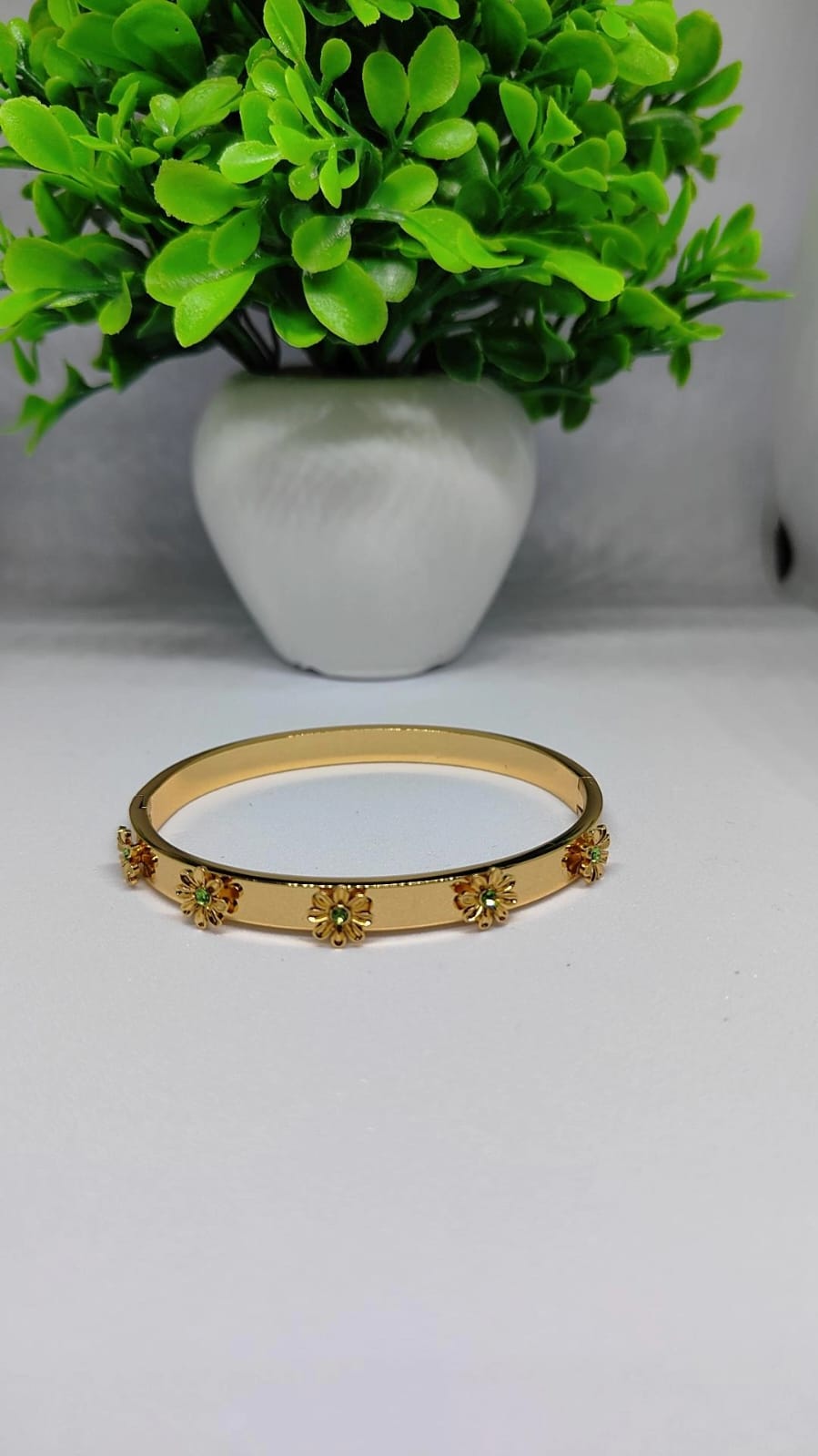 Gold Floral Bloom Bangle with Emerald-Green Accents